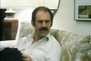 Mature guy with majestic mustache eats a glamorous dark brown