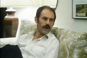 Mature guy with majestic mustache eats a glamorous dark brown