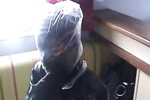 Nasty slut in latex outfit puts a plastic bag over her head