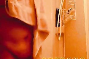 My bulky older girl in the baths on hidden webcam clip