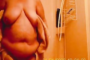 My bulky older girl in the baths on hidden webcam clip