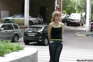 Sveta changes her garments in the street after peeing her panties