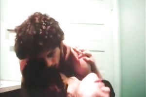 Horny swarthy cutie sucks white large knob in public restroom