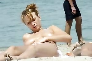 Hidden livecam episode with a well-endowed hottie sunbathing topless