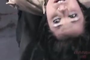 A fellow toys suspended chick's cum-hole and makes her engulf his dick