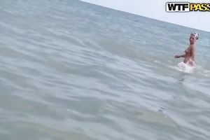 Amateur blond lets a fellow play with her holes on a beach