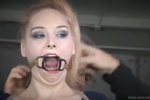 Playful blond floozy with ring gag in her throat receives her feet licked