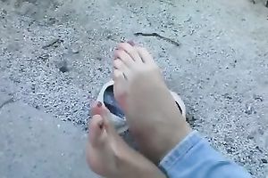 Slim dilettante legal age teenager demonstrates her soles in the street
