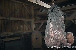 Salacious blondie bounded with fishnet receives her coochie toyed