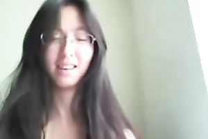 Cute and frisky Asian cheating wife stripteases on livecam and masturbates