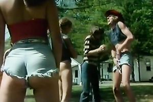 Stunning retro scene with coeds playing basketball outdoors