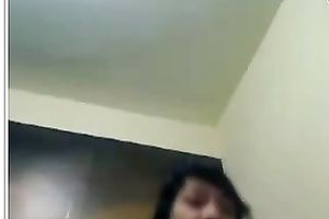 This beautiful looking cam model shows off her rounded bum