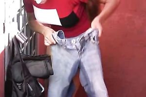 Skinny long-haired dark brown pees in her jeans in a public place