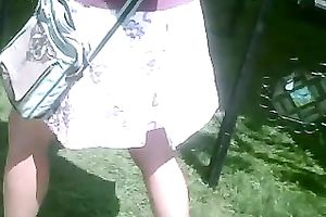 Pigtailed chick at a fair flashes her pants in hidden webcam video