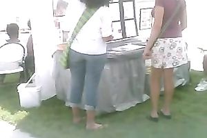 Pigtailed chick at a fair flashes her pants in hidden webcam video