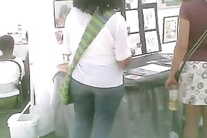 Pigtailed chick at a fair flashes her pants in hidden webcam video