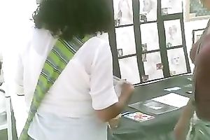 Pigtailed chick at a fair flashes her pants in hidden webcam video