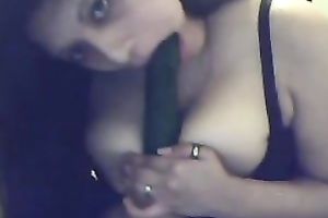 Busty Argentinian brunette hair hottie plays with a cucumber on cam
