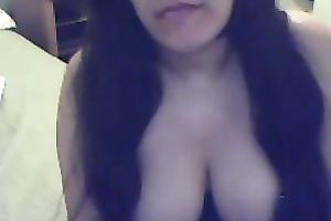 Busty Argentinian brunette hair hottie plays with a cucumber on cam