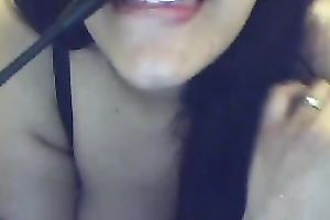 Busty Argentinian brunette hair hottie plays with a cucumber on cam