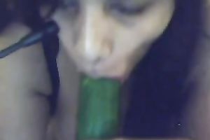 Busty Argentinian brunette hair hottie plays with a cucumber on cam