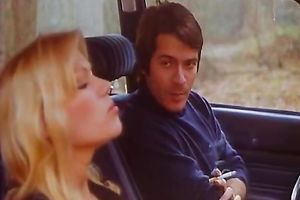 Cute blond fingers her love tunnel in a car and lets a fellow see her