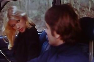 Cute blond fingers her love tunnel in a car and lets a fellow see her