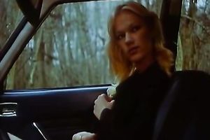 Cute blond fingers her love tunnel in a car and lets a fellow see her