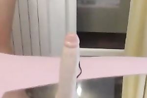 Stunning cutie with pretty eyes is engulfing her sex-toy like eager