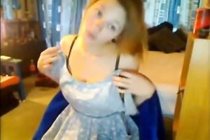 Enticing golden-haired teen undresses on web livecam in the evening