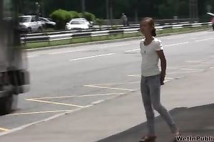 Kristina pees in her taut jeans in a public place