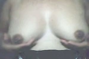 Chubby Asian dilettante white wife flashes her large saggies on cam