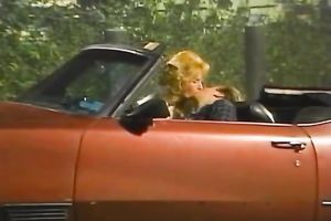 Skinny man polishes the snatch of a breasty blond white wife on the table