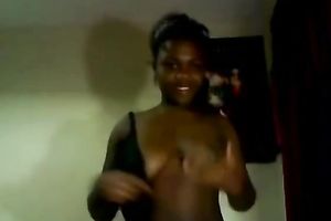 Chocolate nympho takes off her raiment and shows her private parts