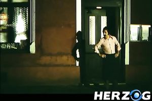 Hot retro scene with a blonde engulfing a weiner in a bar