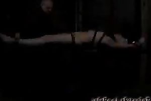 Sexy blonde whore with tattooed and miniature boobs is crucified and tortured