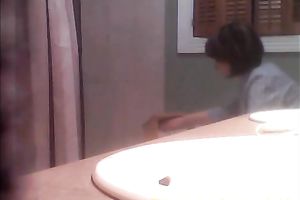 Spying on my toothless black cock sluts peeing in the washroom