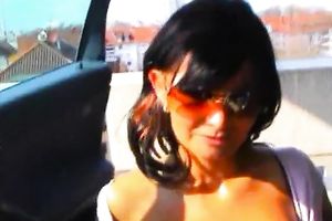 Perverted sexually excited dark brown gives a oral sex in the car