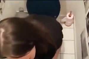 Attractive dark brown co-worker sucks my dick in a latrine