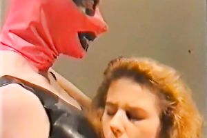 Classic playgirl gives oral-sex to one weird fellow in latex mask