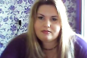 This breasty web camera model with large zeppelins licks a sweetmeat seductively