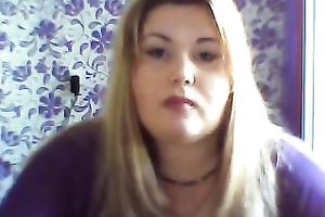 This breasty web camera model with large zeppelins licks a sweetmeat seductively
