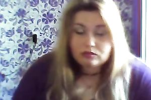 This breasty web camera model with large zeppelins licks a sweetmeat seductively