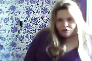 This breasty web camera model with large zeppelins licks a sweetmeat seductively