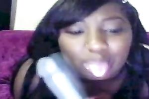 Black whore pokes her wazoo gap with her thick sex-toy