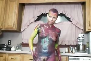 Nerdy short-haired skank paints on her body in the kitchen