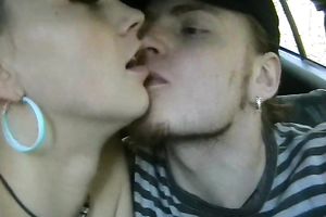 White teen eats a large pulsating rod in the car on web camera