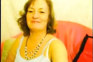 Mature skank fingers her hirsute cunt in sexy cam solo scene