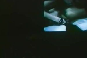 Two concupiscent brunettes toying shaggy wet cracks during the time that watching TV