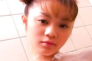 Horny Japanese coed with merry marangos lathers her body with soap seductively